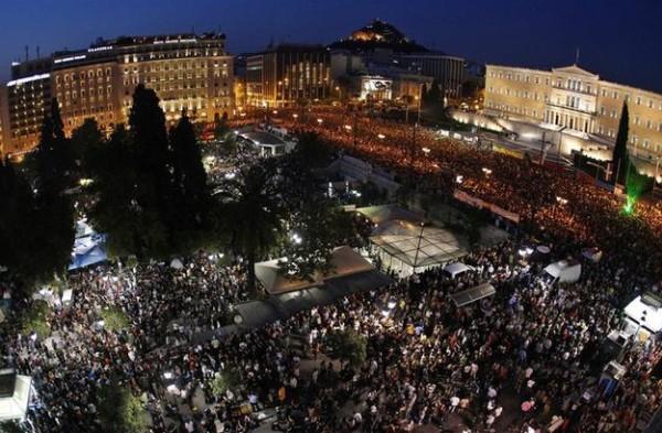 Anti-austerity demonstrators in front of the Greek parliament. Photo by Kotsolis via Wikimedia Commons
