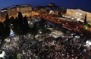 Anti-austerity demonstrators in front of the Greek parliament. Photo by Kotsolis via Wikimedia Commons