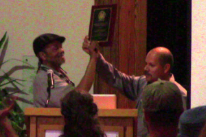 Armando Robles and William "Poppin" Swanson accept the Ricky Maclin Award for Cooperative Innovation at the Eastern Conference for Workplace Democracy, 2015