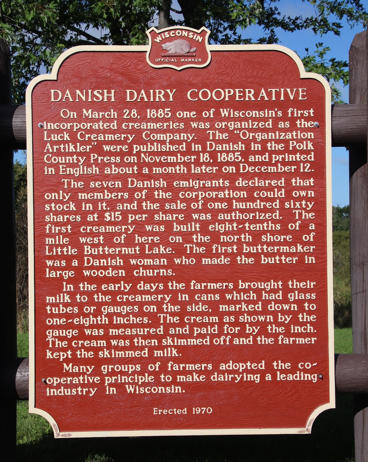 Historical sign detailing the history of the first Wisconsin dairy cooperative.