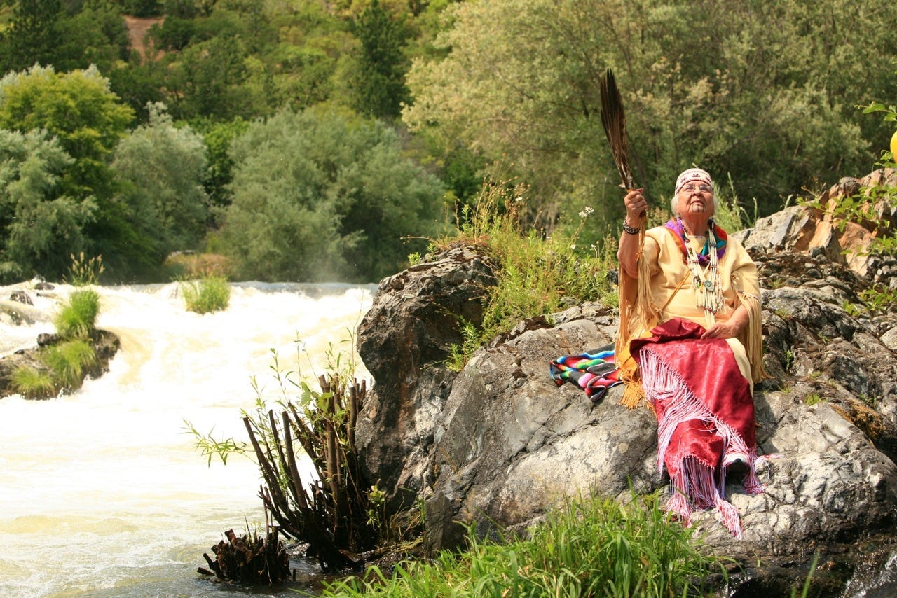 Agnes Pilgrim in the Story Chair next to Ti’lomikh Falls. Photo by Rory Finney (2012)