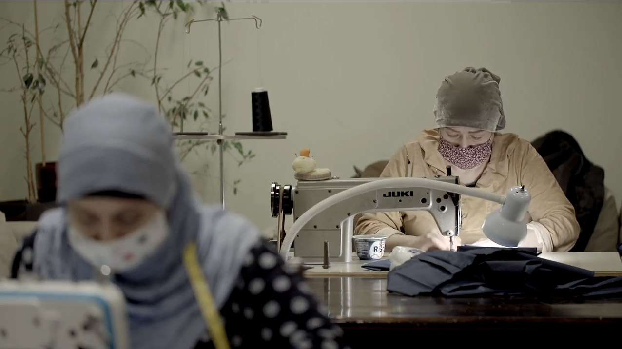 Visible Hand activists from a local group in Trojmiasto involving emigrants from Chechnya sew face masks for the local hospital.
