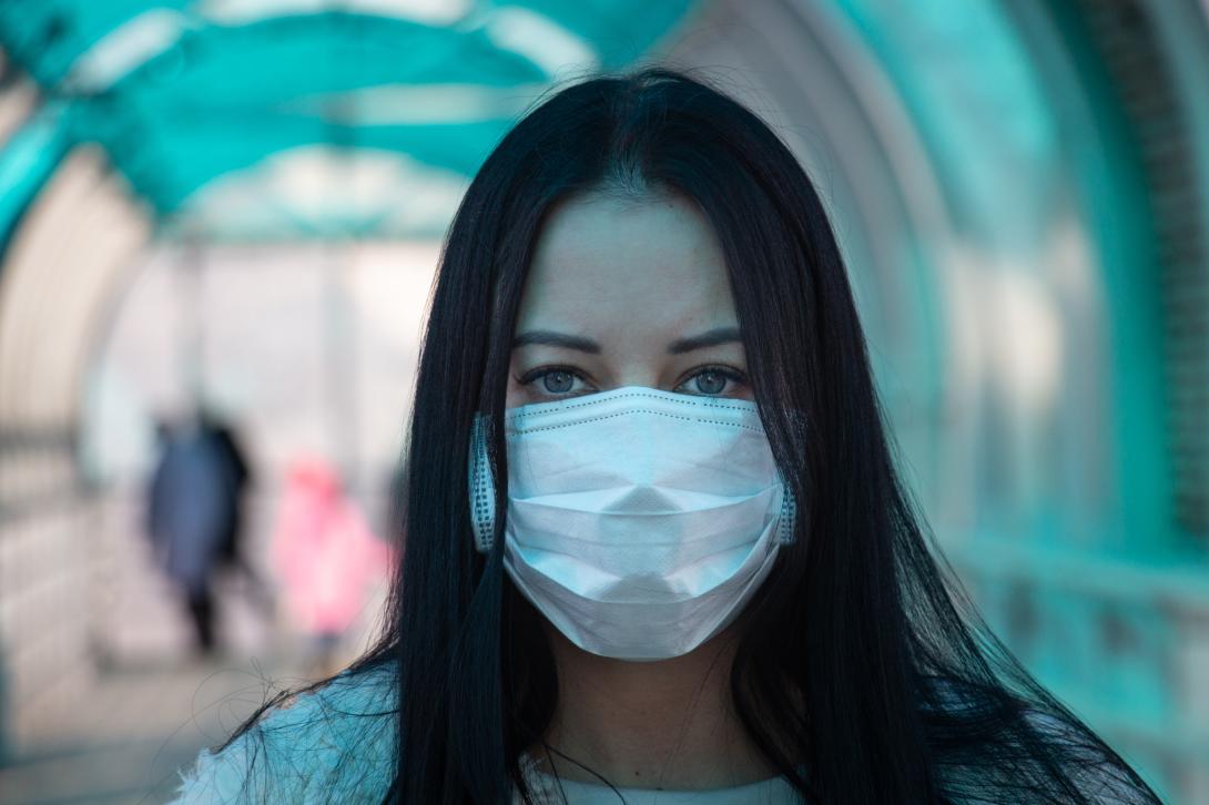 Woman wearing a surgical mask.