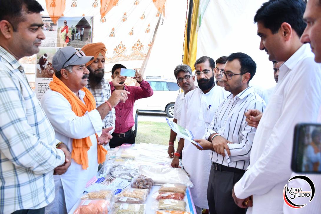 Organisation chairman Bhagwan Singh Khudi explaining the range of organic products at a shopping festival in Hanumangarh.