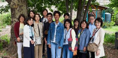 Leader of a community garden, Jessica (center), with members of the group