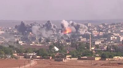 Siege of Kobani, 2015. <a data-cke-saved-href="https://en.wikipedia.org/wiki/Siege_of_Koban%C3%AE#/media/File:Coalition_Airstrike_on_ISIL_position_in_Kobane.jpg" href="https://en.wikipedia.org/wiki/Siege_of_Koban%C3%AE#/media/File:Coalition_Airstrike_on_ISIL_position_in_Kobane.jpg" target="_blank">Public Domain</a>
